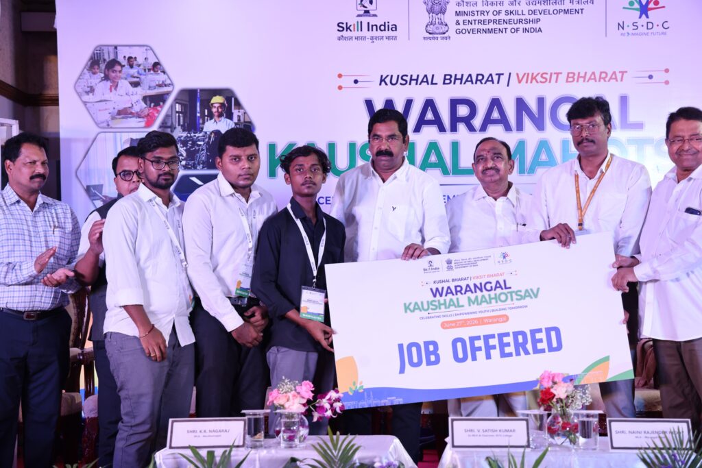 Selected candidates display their appointment letters alongside government officials and industry representatives during Kaushal Mahotsav – Warangal 2026, where more than 1,000 youth from Telangana secured job offers from over 90 participating companies on Saturday.