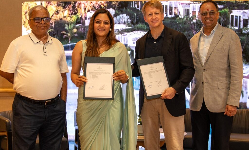 Amrita Gupta, Director of Manglam Group and CEO of Manglam Spa and Resorts, and Rajeev Menon, President, Asia Pacific (excluding Greater China), Marriott International, exchange documents after signing the agreement for a new Sheraton Hotel in Jaipur, in the presence of David Marriott, Chairman of the Board, Marriott International, and N.K. Gupta, Founder and Chairman of Manglam Group, on Wednesday.