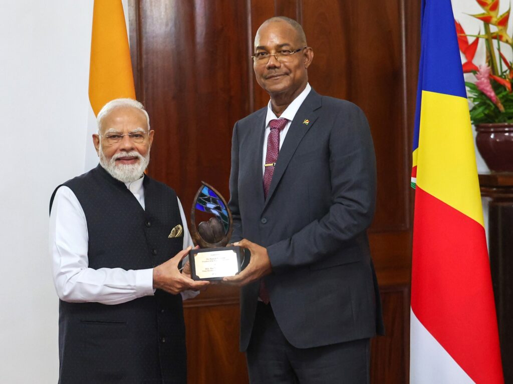 President Dr Patrick Herminie of Seychelles confers the inaugural 'Guardian of the Blue Horizon' Presidential Distinction on Prime Minister Narendra Modi during a special ceremony in Victoria, Seychelles, on Sunday.