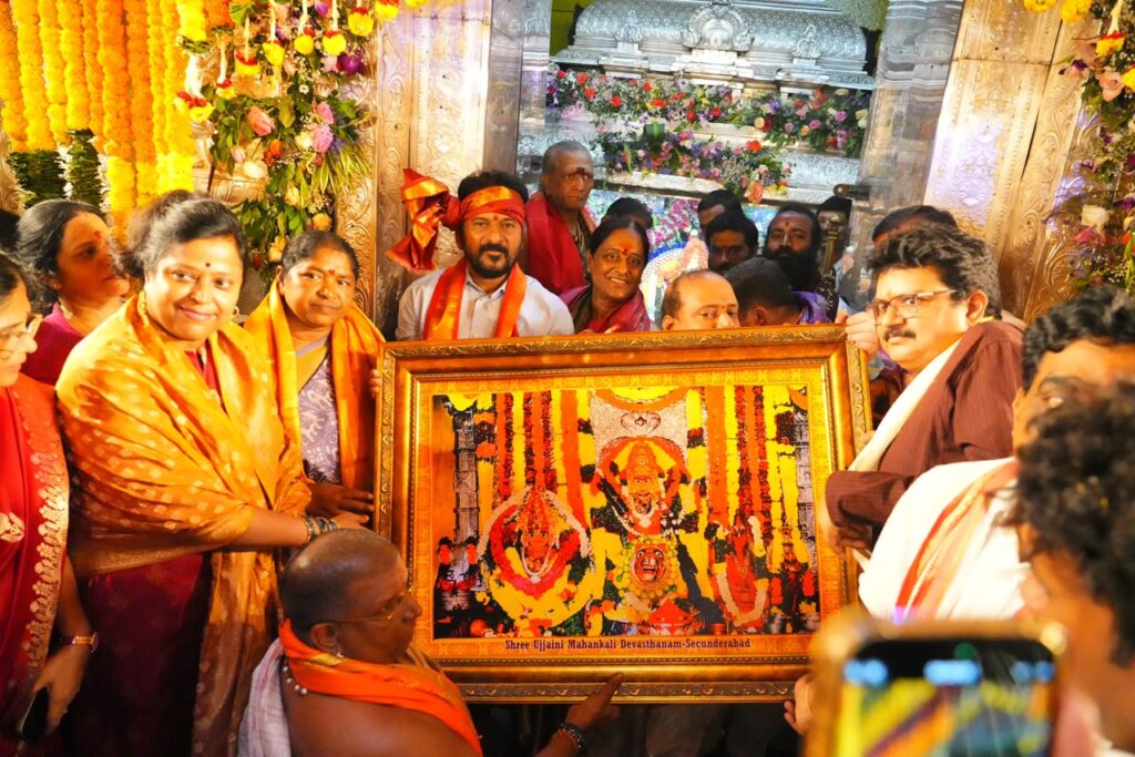 Telangana Chief Minister A. Revanth Reddy offers Pattu Vastralu to Goddess Ujjayini Mahakali and participates in special prayers at the Ujjayini Mahakali Temple in Secunderabad during the Bonalu celebrations. Later, Dr. Kota Neelima, along with the temple's chief priests, presents him with a sacred portrait of Goddess Ujjayini Mahakali as a mark of reverence and divine blessings.
